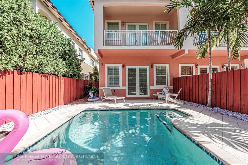 Private pool with view of primary suite balcony.