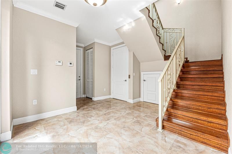 Entryway, with powder room and private elevator entry with access to all floors.