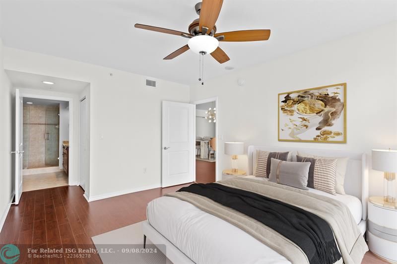 Ensuite Bath and large wak-in closet. Wood-look floors throughout the residence.