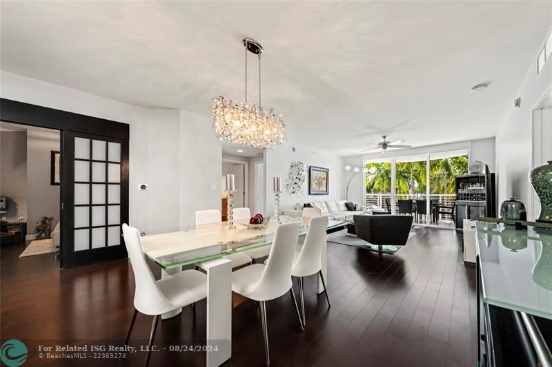 Dining area, den/office behind the sliding french doors