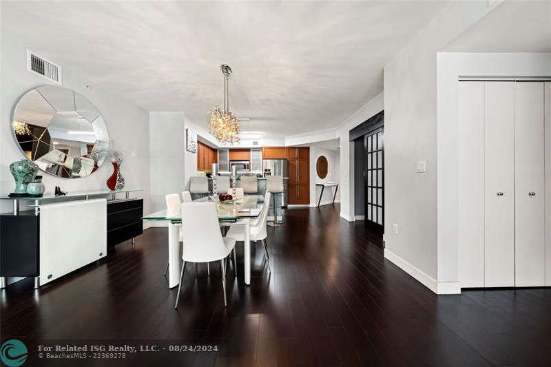 Looking back to entry foyer, den in the center right, w/d behind the doors