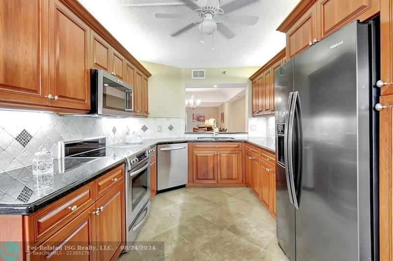 Gorgeous and Spacious Kitchen with updated Cabinets and Granite Countertops w All Newer SS Appliances!