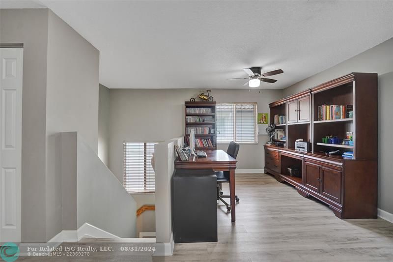 Entry with the garage access on the left and half bath on the right leading to the kitchen and living room.