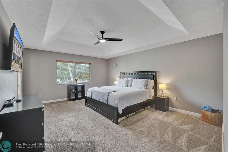 Entry with the garage access on the left and half bath on the right leading to the kitchen and living room.