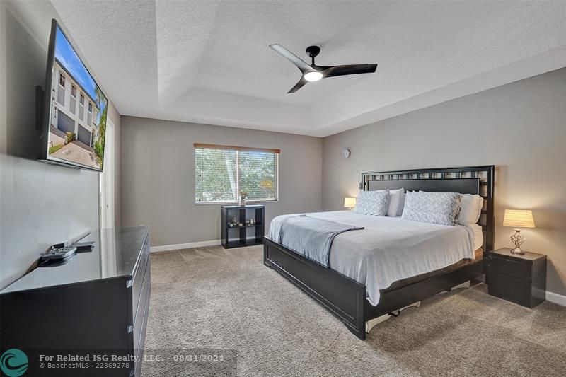 Entry with the garage access on the left and half bath on the right leading to the kitchen and living room.