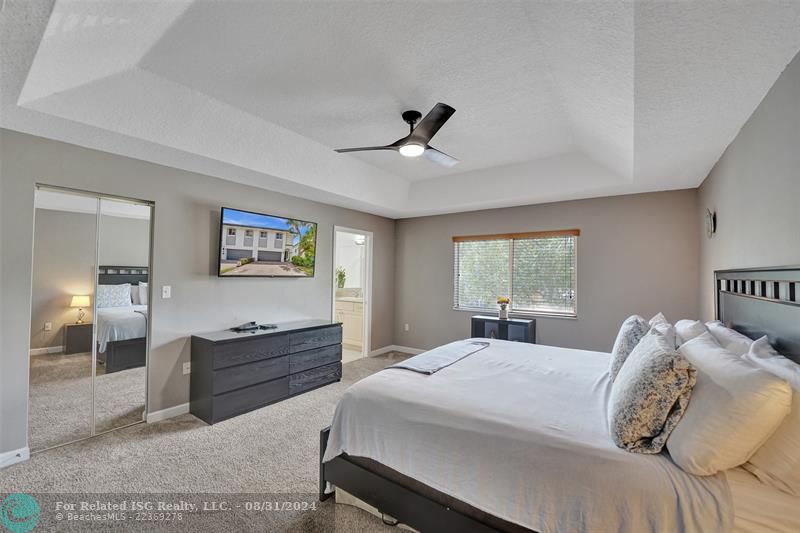 Entry with the garage access on the left and half bath on the right leading to the kitchen and living room.