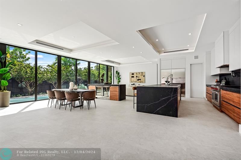 The living space with dining area, kitchen, and living room.