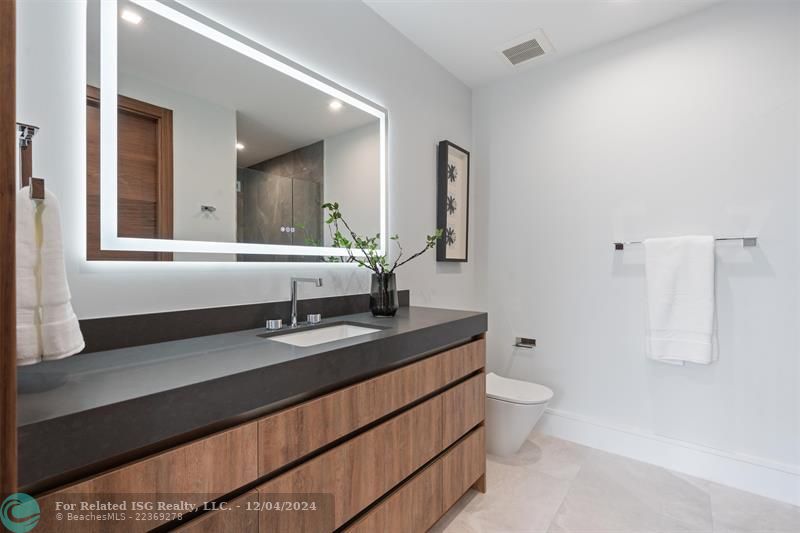 Second floor bathroom with shower and closet.