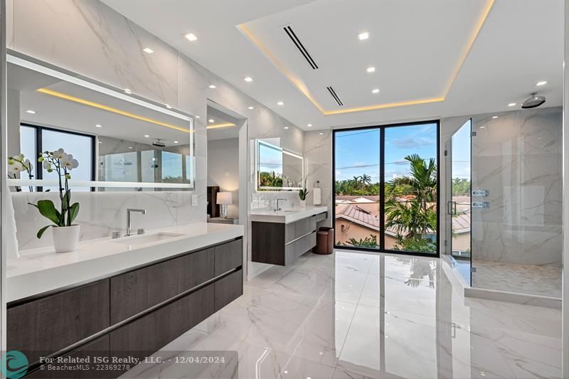 Double vanity and shower in the primary bathroom.