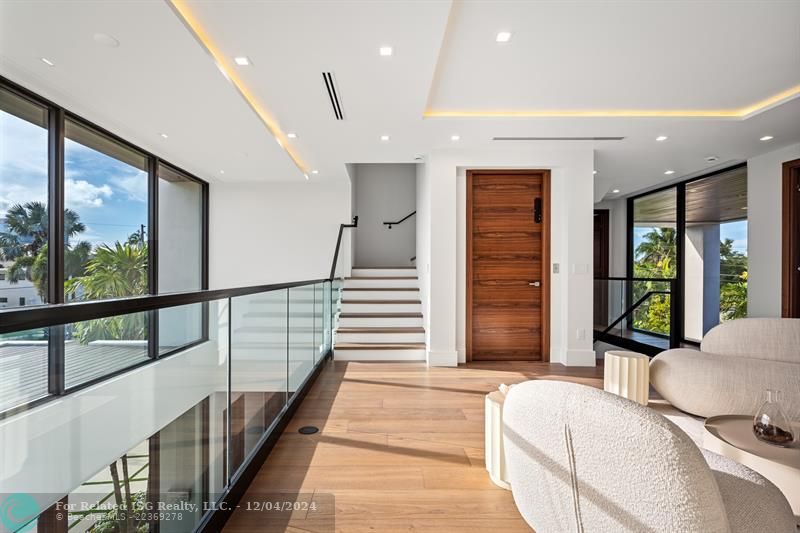 Sitting area on the second level. The door is to the elevator.