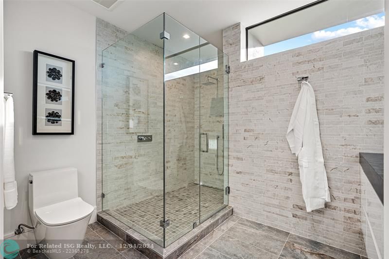 Bathroom and glass enclosed shower.