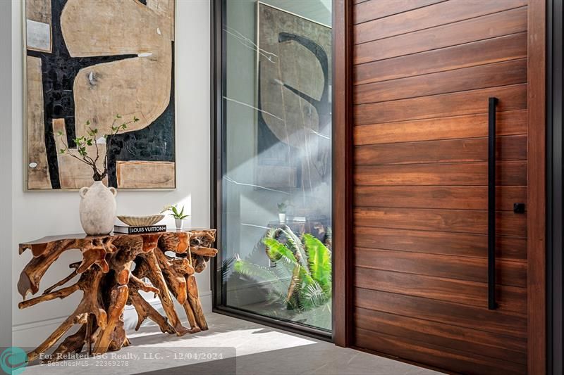 The homes wood pivot door.