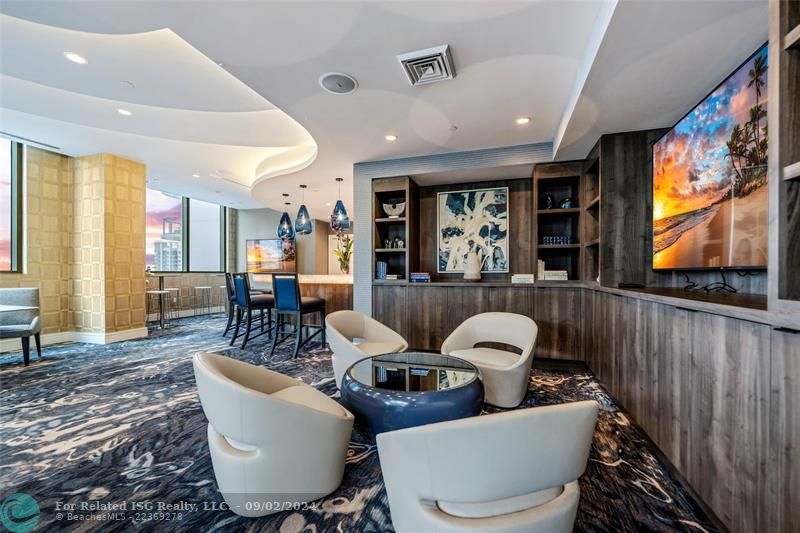 One of the indoor lounge areas complete with bar area & seating for entertaining for a game, movie night or business meeting...Complete with a catering kitchen too!