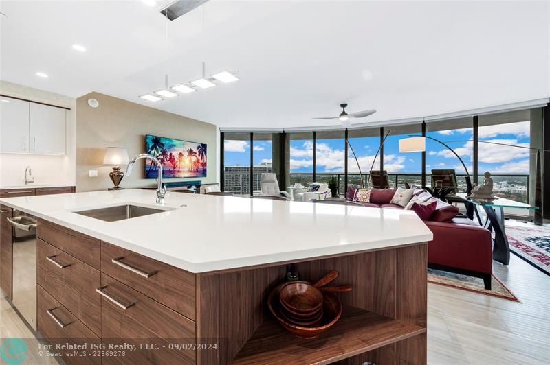 Gorgeous kitchen with Nolte cabinetry, tons of storage, large waterfall island, wet bar & amazing views!