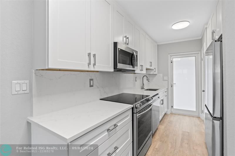 Sleek quartz countertops and backsplash