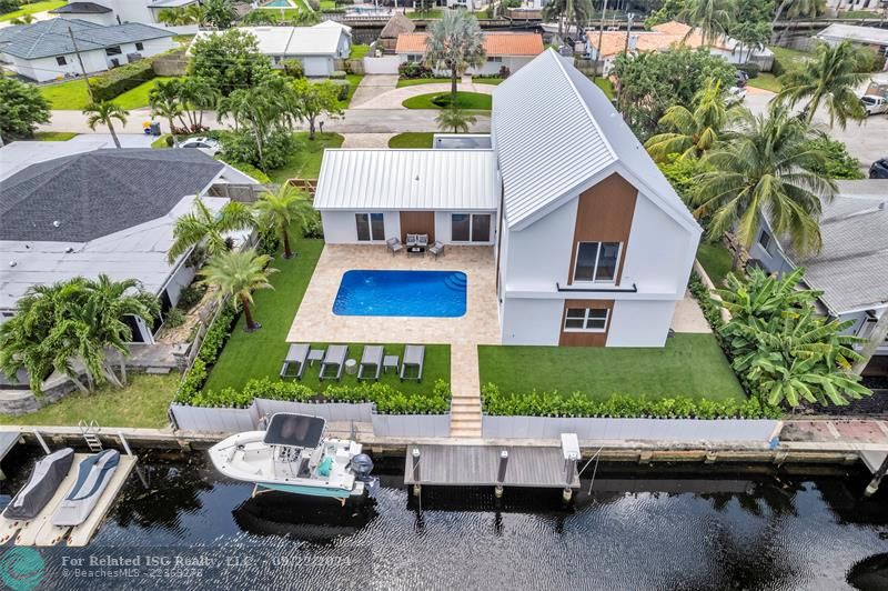 Backyard with low maintenance turf, pool and fountains