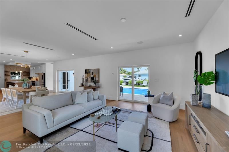 living room with view of the pool