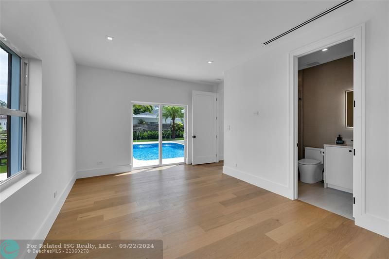 Bedroom 1 with ensuite bathroom & pool view on the first floor