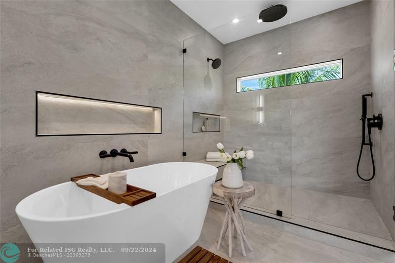 Spa like En Suite master bath with freestanding soaking tub and separate shower stall