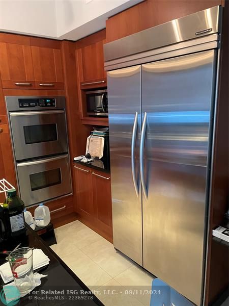 Snaidero Kitchen Cabinets w/SS Double Oven and SS Kitchen Aid Refrigerator/Freezer