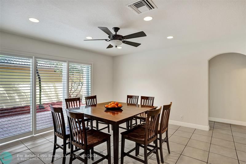 Three large sliding doors from the dining room to the patio bring in plenty of natural light and provide easy access for gatherings. There are no direct views from neighbors, ensuring your privacy.