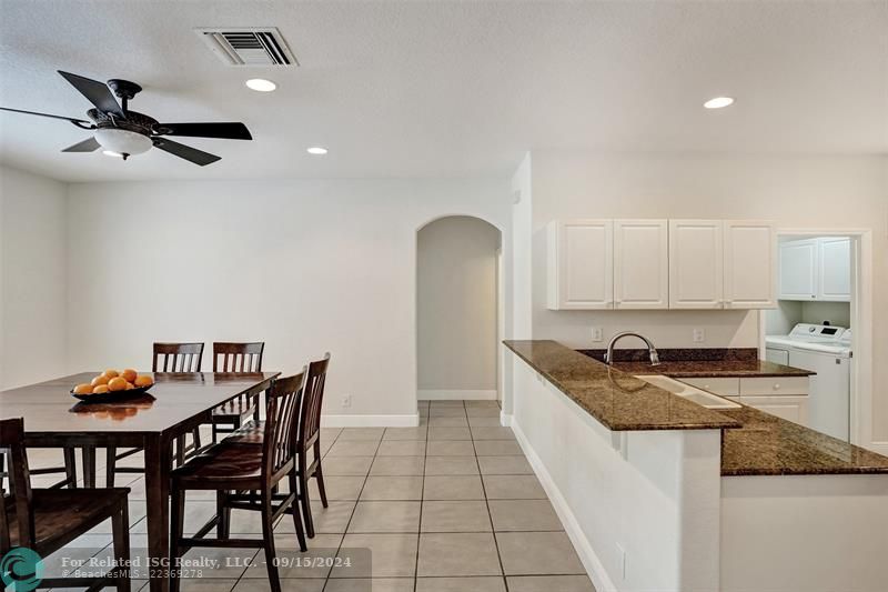 Open kitchen with a large dining room. The laundry room is located in the back.