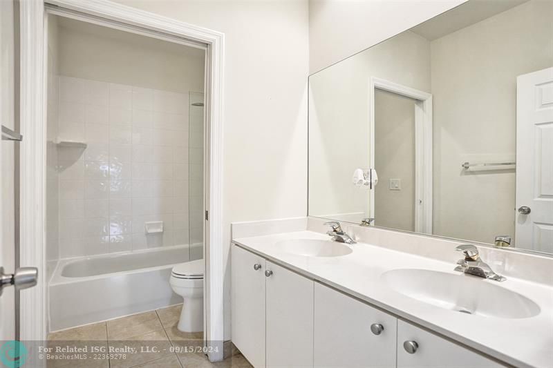 Bathroom in between with two sinks.