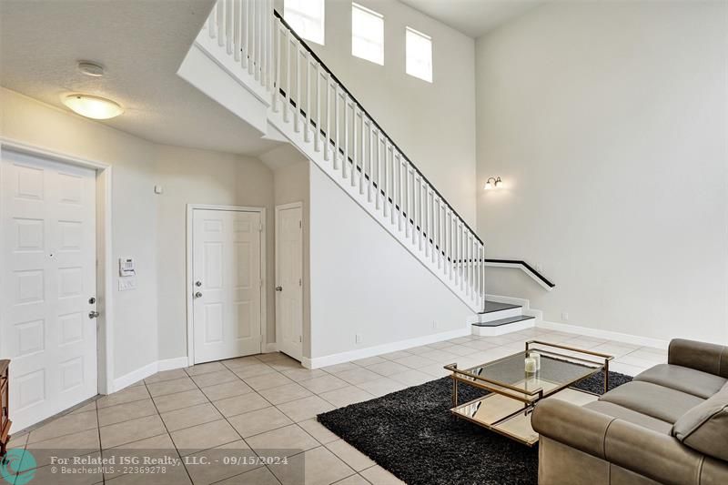 On your left as you enter, you’ll find access to the garage along with additional storage space under the stairs.