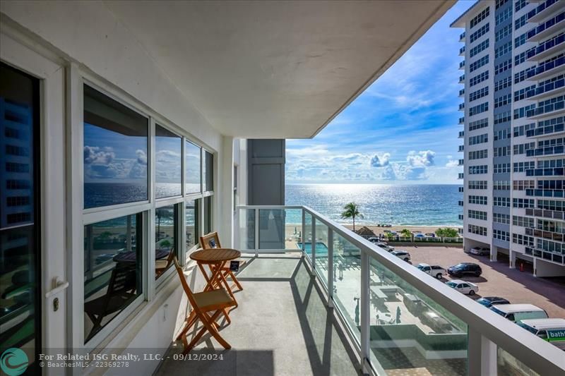 Beach/pool views on oversized glass balcony