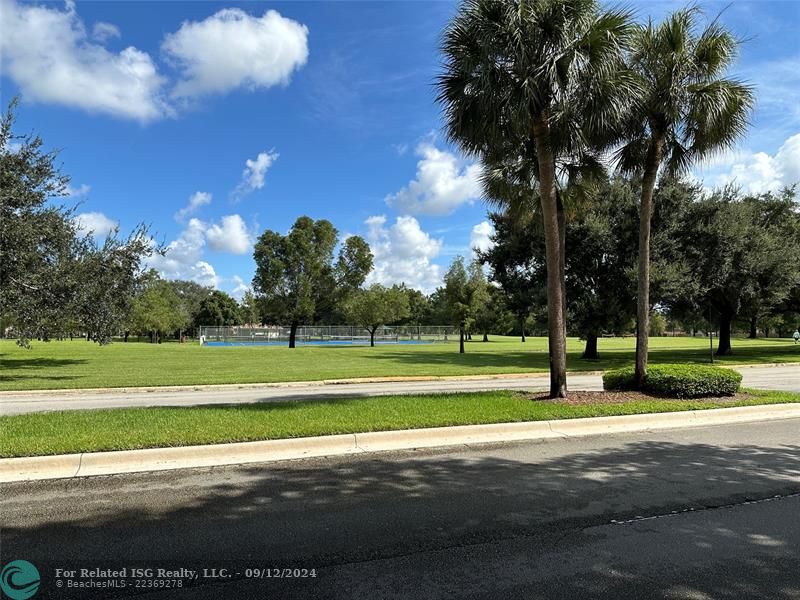 Tennis, walking path, swings, basketball