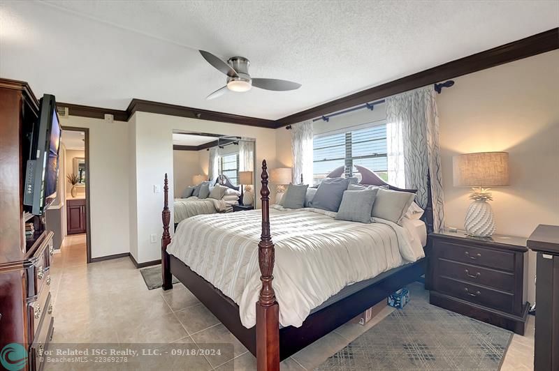 1 of 2 Master Bedroom Suites! Detailed Woodwork on Doors and Walls! Open To Patio! Walk-In Closet & Wall Closet!