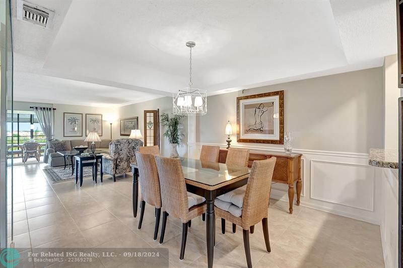 Formal Dining and Living Areas with Wainscoting and Crown Mouldiing Throughout This Stunning Penthouse Corner Unit! 1906 Sq FT! 2 Master Bedrooms with En-Suite Bathroom and 1 Half Bath for Guests!