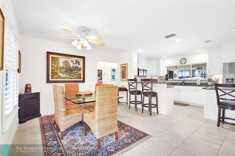 DINING AREA NEXT TO OPEN KITCHEN