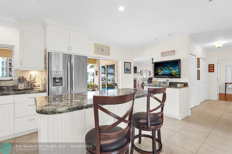 BREAKFAST BAR LOOKING INTO OPEN KITCHEN