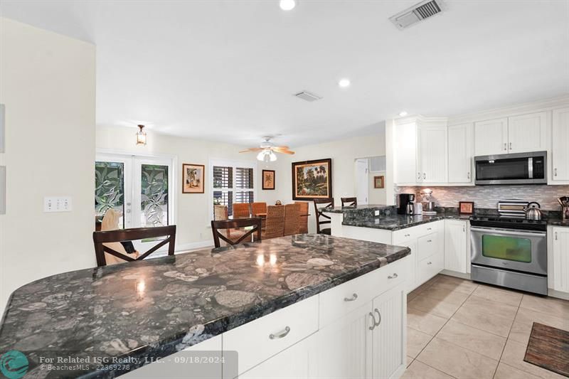 OPEN KITCHEN WITH STAINLESS STEEL APPLIANCES