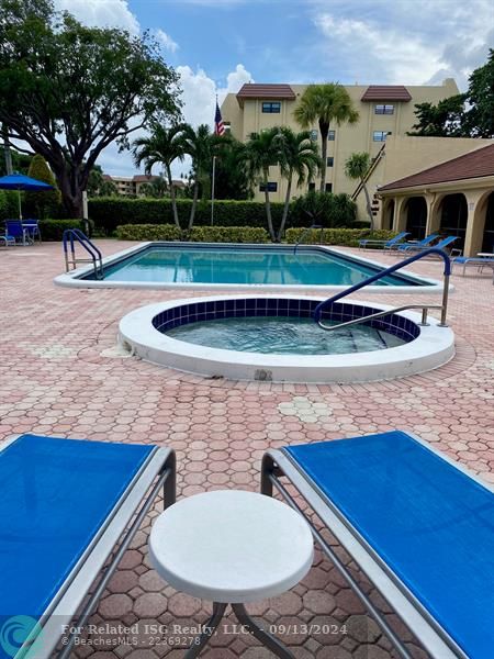 1 of 2 Heated pool and Jacuzzi! WiFi, Music, Bathrooms and Covered Eating Areas! Clubhouse!