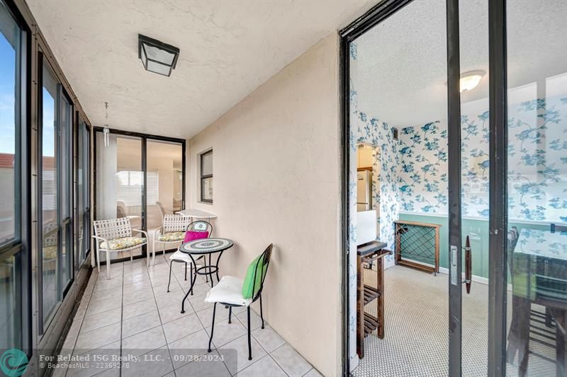 EAST BALCONY & SLIDING DOORS TO KITCHEN