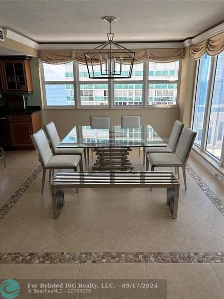 Dining room table and sideboard as pictured have been removed and replaced with a  modern dining table