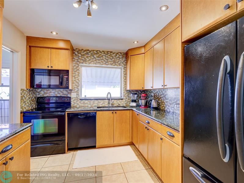 Granite countertops, tile backsplash.