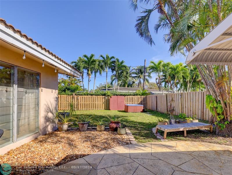 Beautifully manicured and fenced yard with room for a pool.