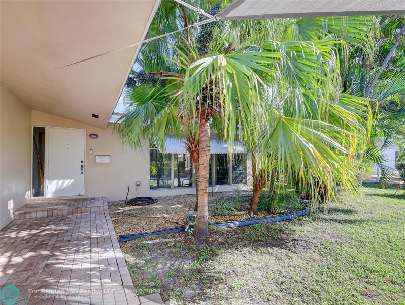 Tree shaded path welcomes you to this charming home.