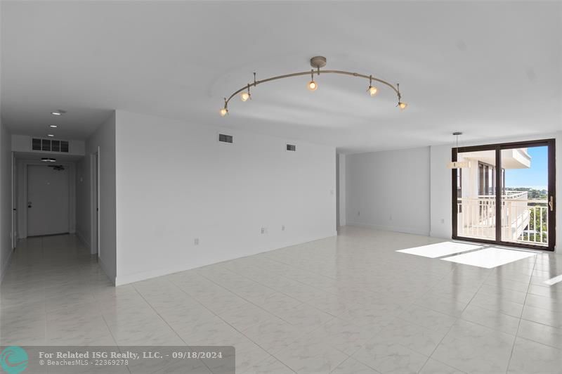 Family/Dining Room Combination. Primary Entrance on the Left, Kitchen Entrance on te Right