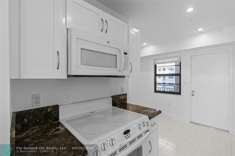 Kitchen w/ 2nd door to the Exterior and Adequate Space for a Dining Table