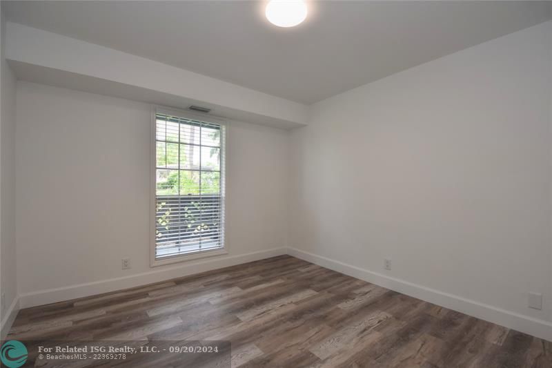 2nd bedroom looks out to patio