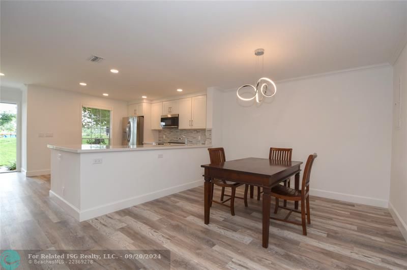 Dining area ties together with kitchen and livingroom