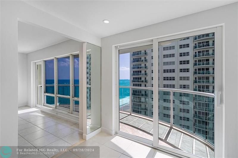 There is an eat in area in the kitchen that has beautiful ocean views.