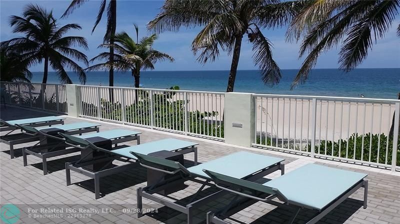 The lower beach deck has plenty of seating, tables and umbrellas.