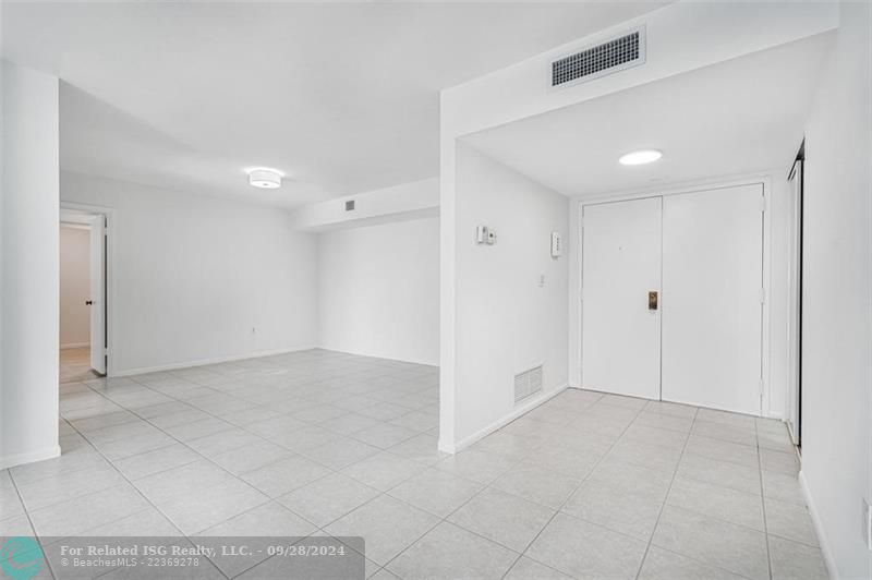 With your back to the windows, this is facing the double door entrance and the dining room. This is a split bedroom layout: so the two bedrooms are on opposite sides of the condo.