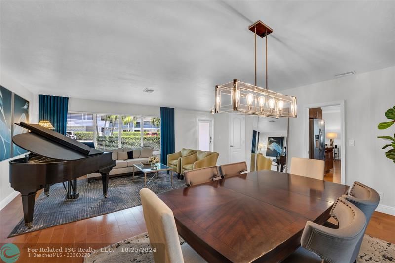 The living room is flooded with natural light streaming into the Impact windows from both sides