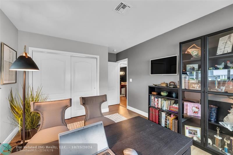 Plenty of closet space with Built ins in this front bedroom, currently serving as a study.